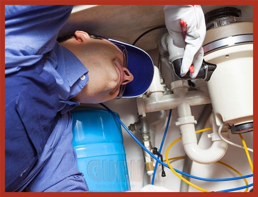 Garburator repair services in a modern kitchen done by Guru Plumber