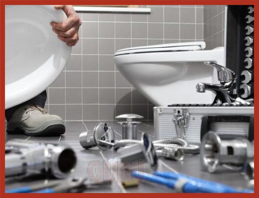 Plumber repairing a malfunctioning toilet unit