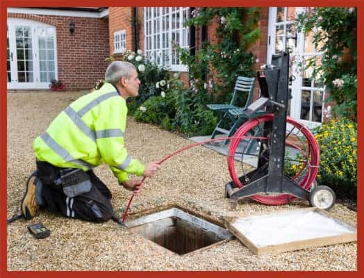 Guru Plumber Inspecting Drain Line in Surrey Home